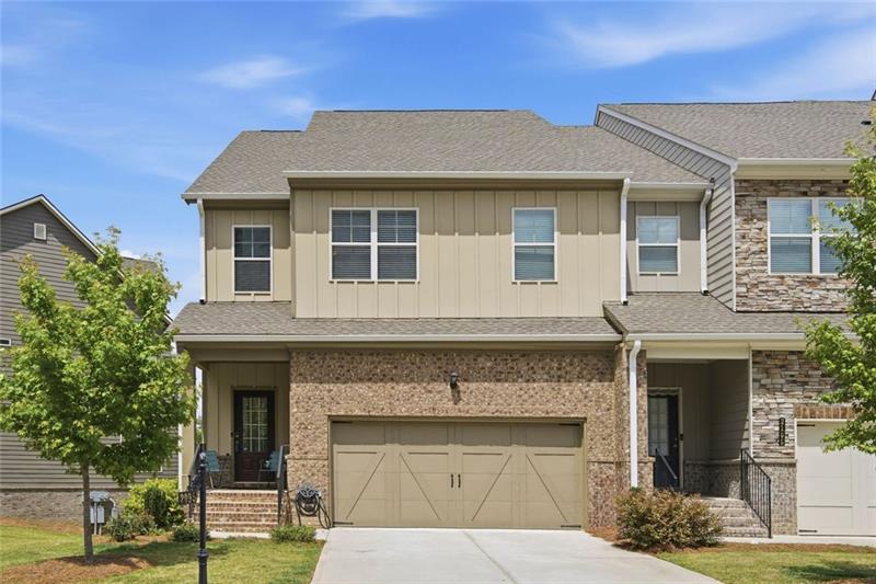 Daylight front exterior of 2095 Manor Pointe Drive with brick facade and two-car garage
